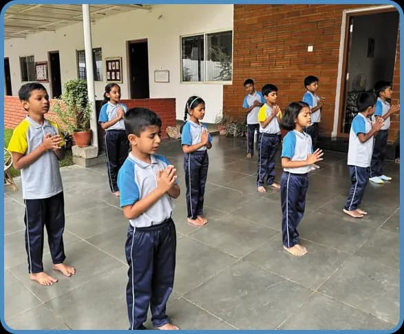 Children working with Montessori materials at Adra