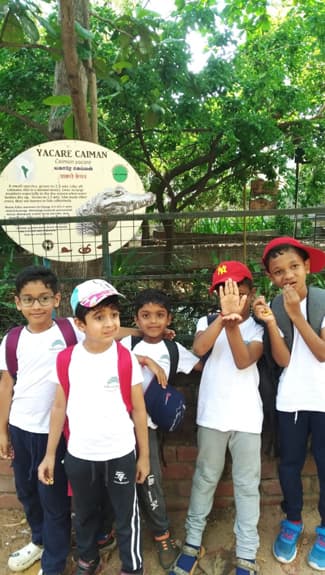 Children on a farm excursion at Adra